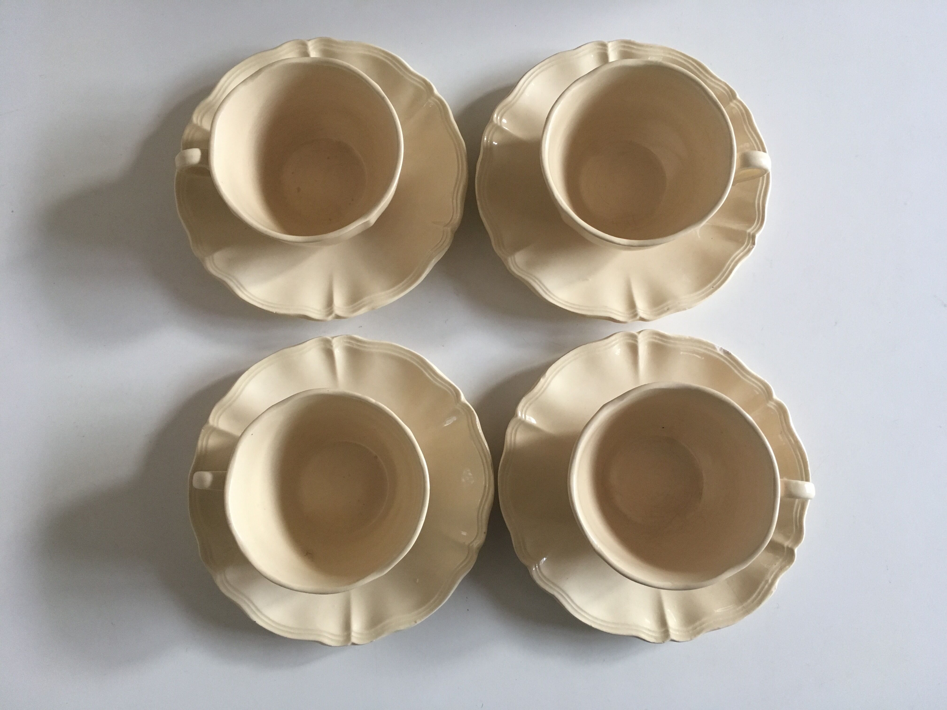 4 cups set in ivory faience from Sarreguemines to godrons