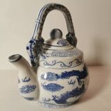 Old Chinese blue and white teapot in vintage ceramic with dragon decor