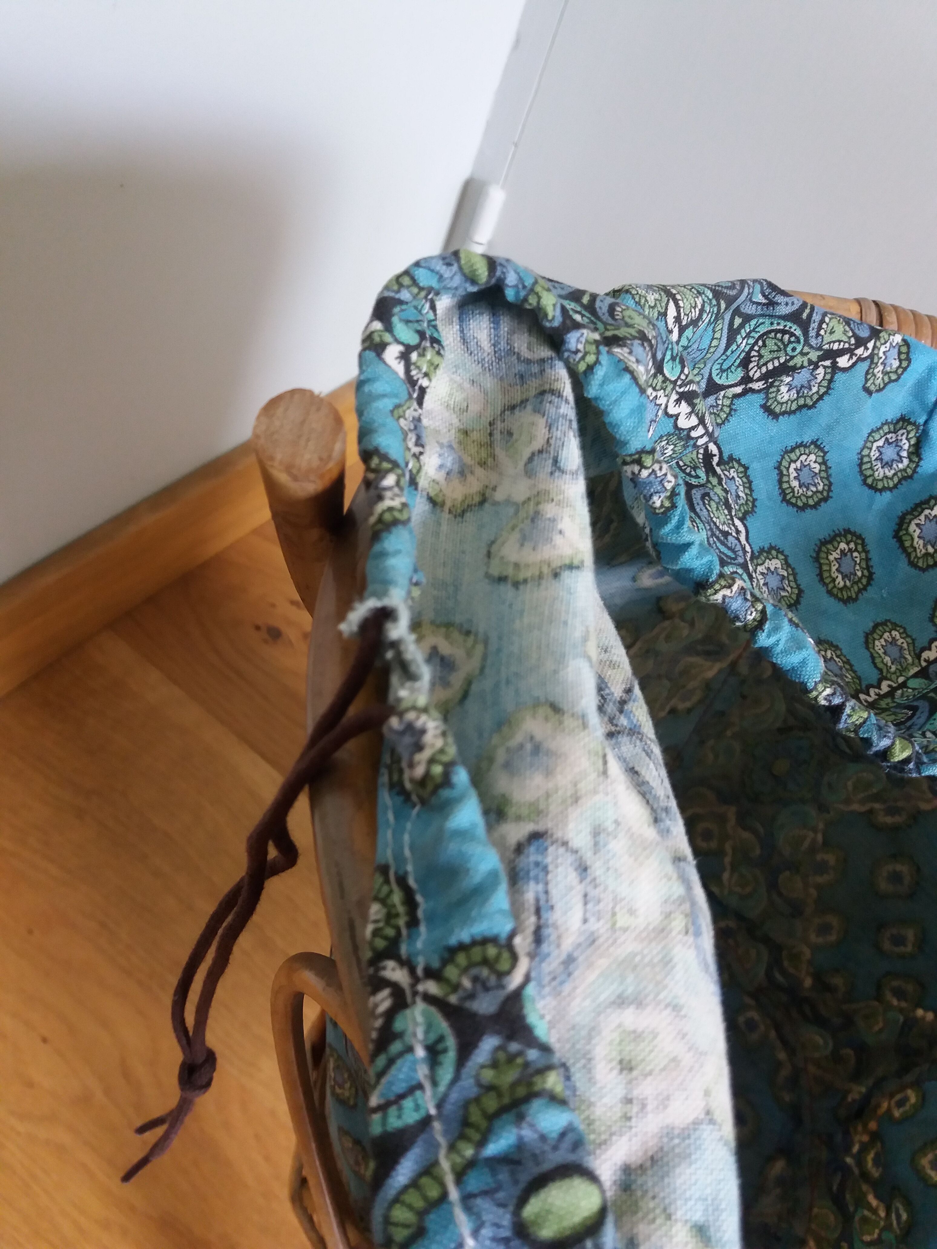 Wicker worker round basket with work, knitting