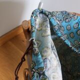 Wicker worker round basket with work, knitting