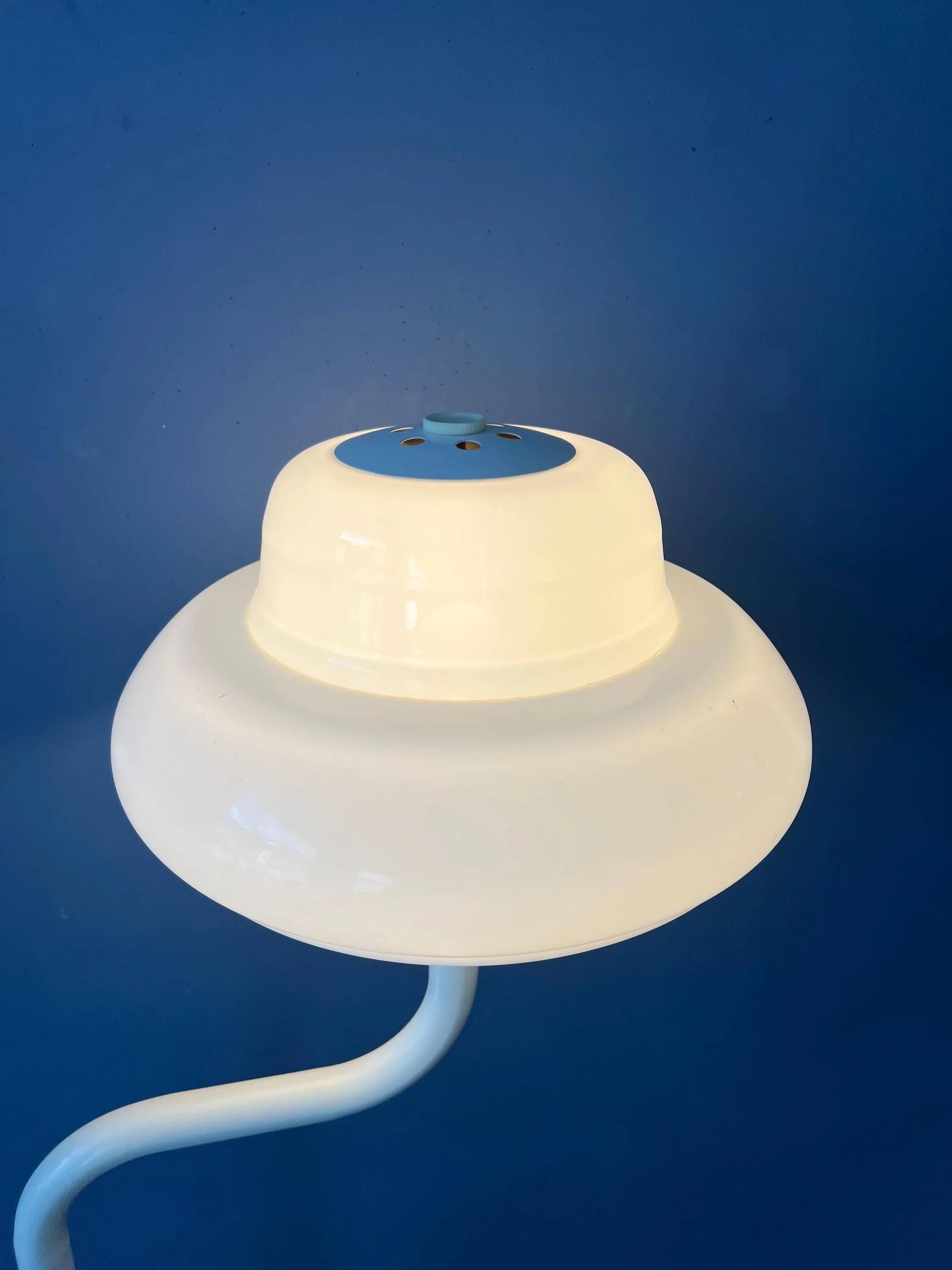 Mid-century mushroom floor lamp with a white plexiglass shade.