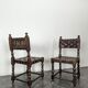 Pair of Spanish style chairs with leather straps.