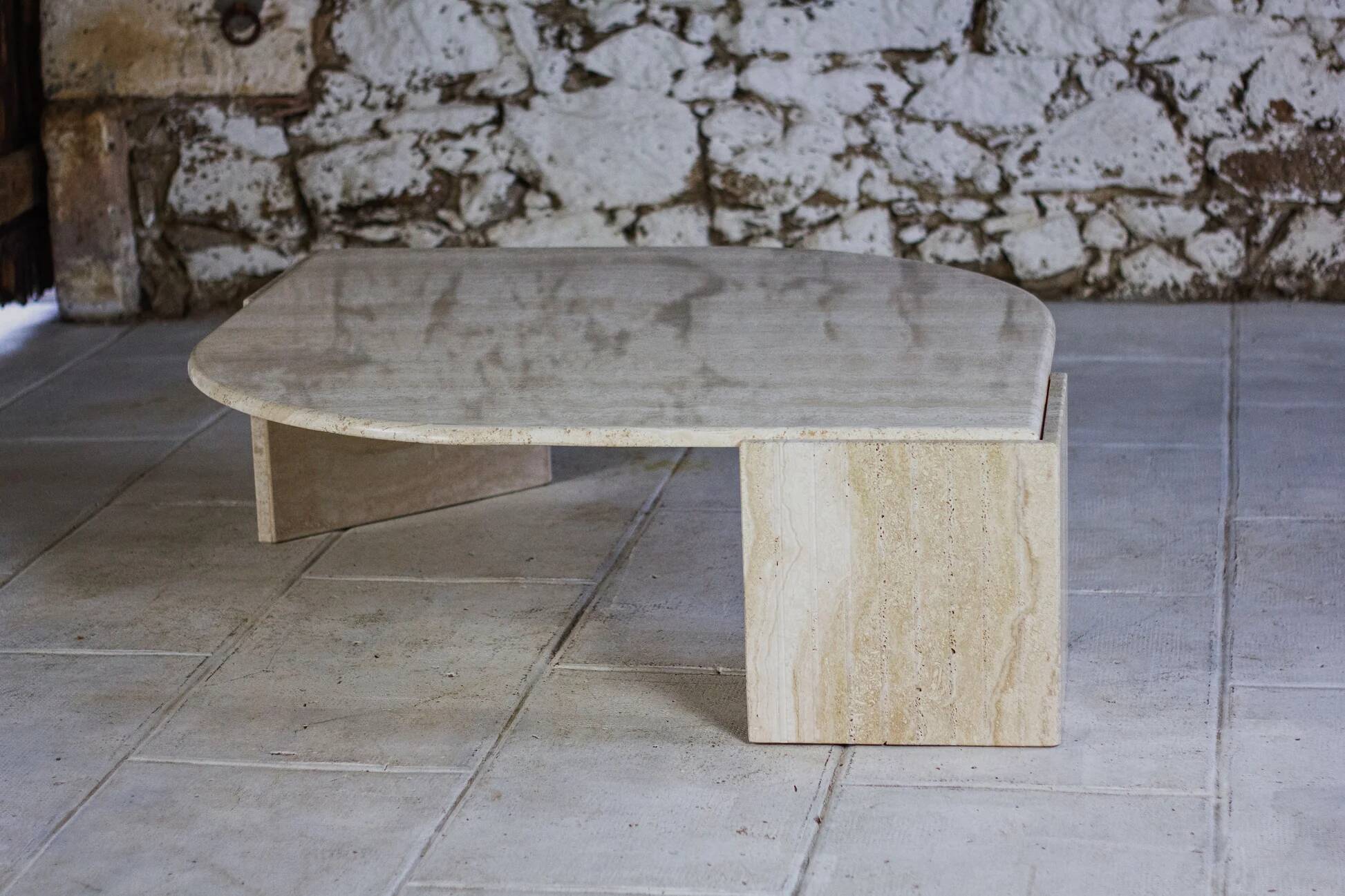 Travertine coffee table "Eye" or "drop" by Roche Bobois, 1980