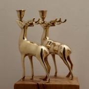 Pair of brass candle holders in the shape of deer from the mid-century.