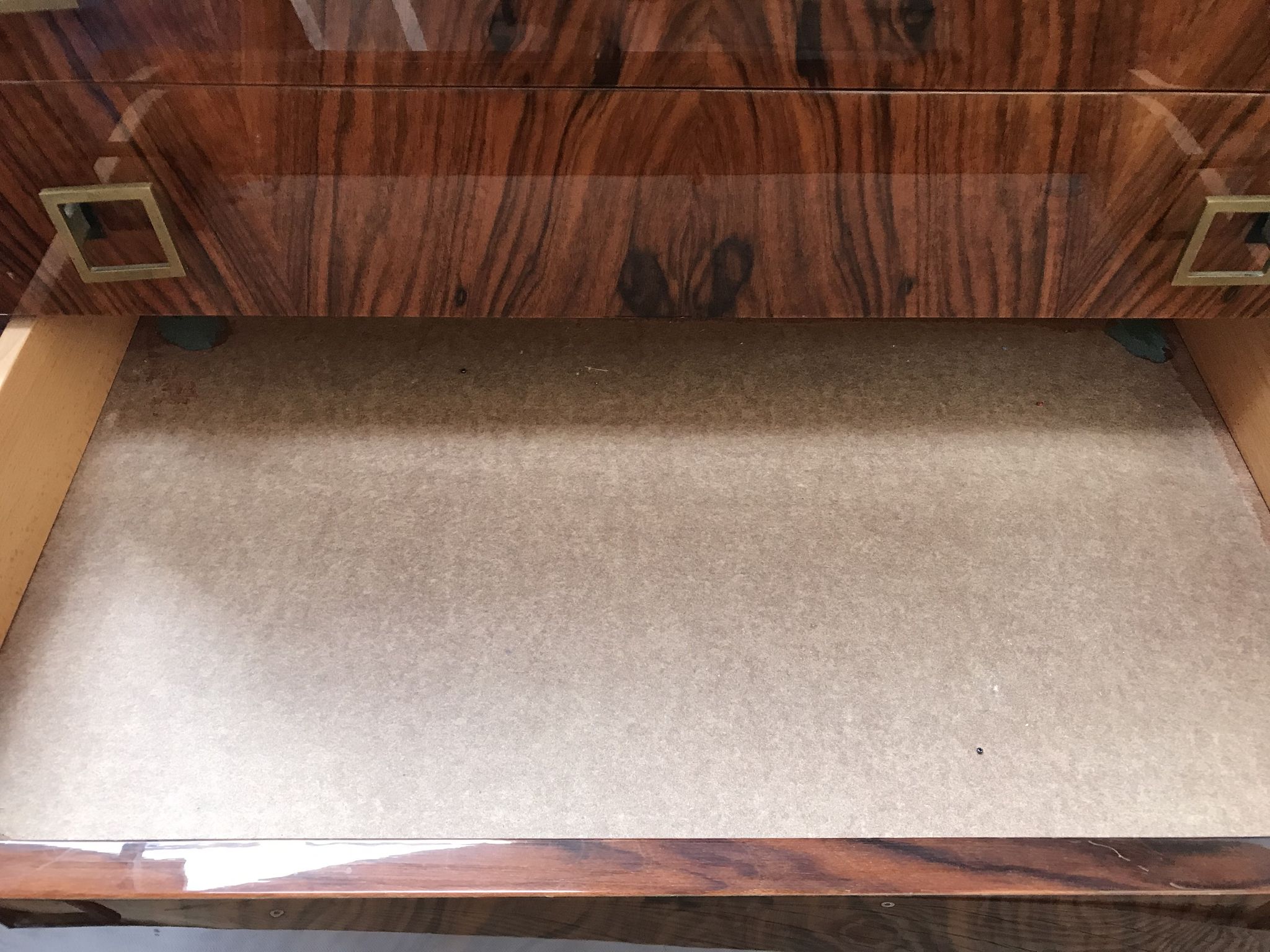 Lacquered 3-drawer chest with rosewood veneer.