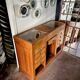 Counter, glass-fronted wooden workbench in dark wood, 8 drawers.