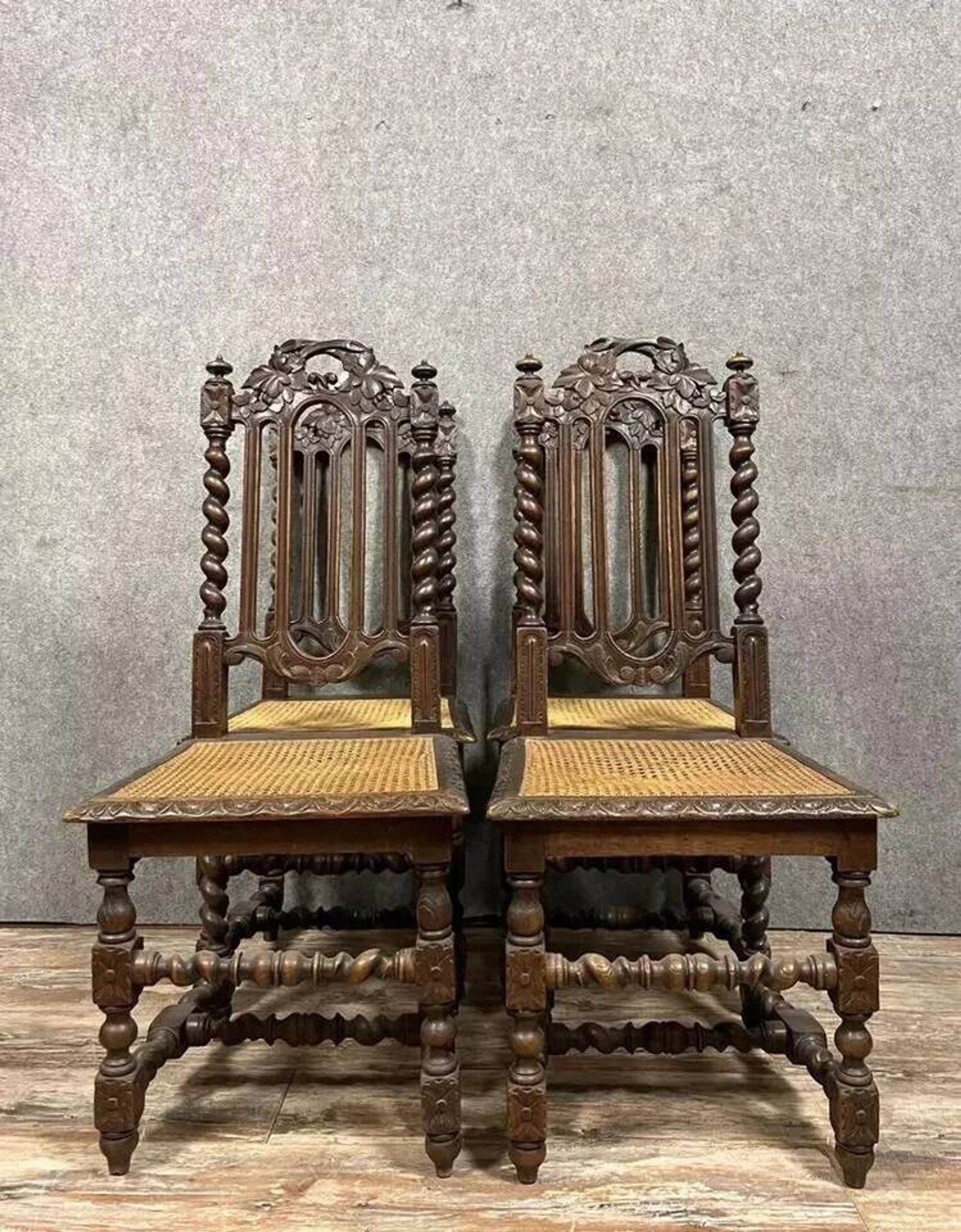 Set of 4 Renaissance style hunting lodge chairs in carved oak