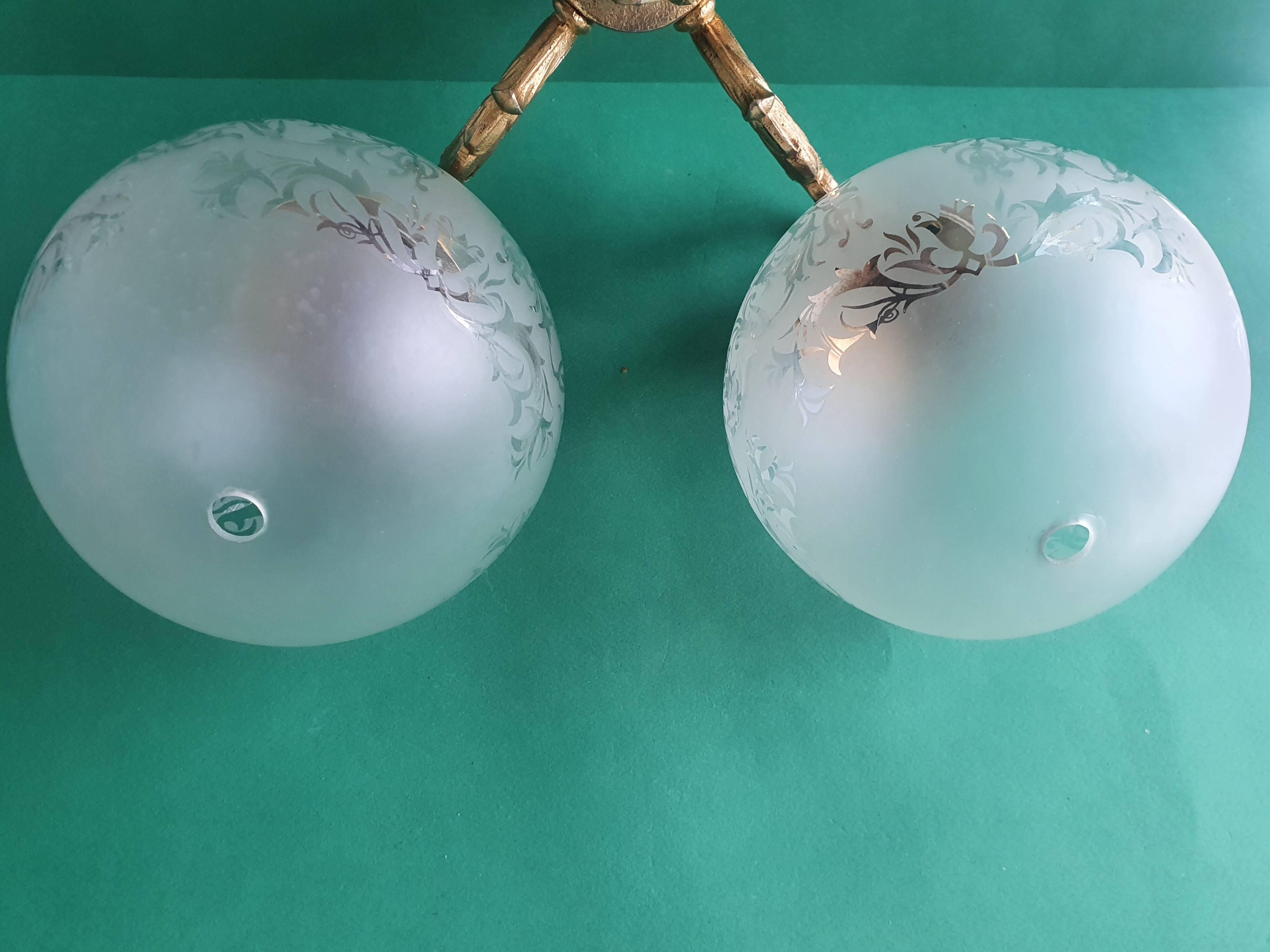 Pair of large double-light wall sconces in vintage brass and glass