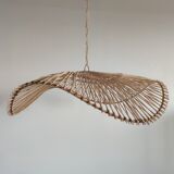 Rattan suspension or lighting fixture in the shape of an undulating circular tray with lattices