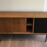 Row with double sliding doors and bar on metal base