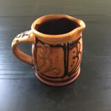 Hand decorated terracotta pitcher