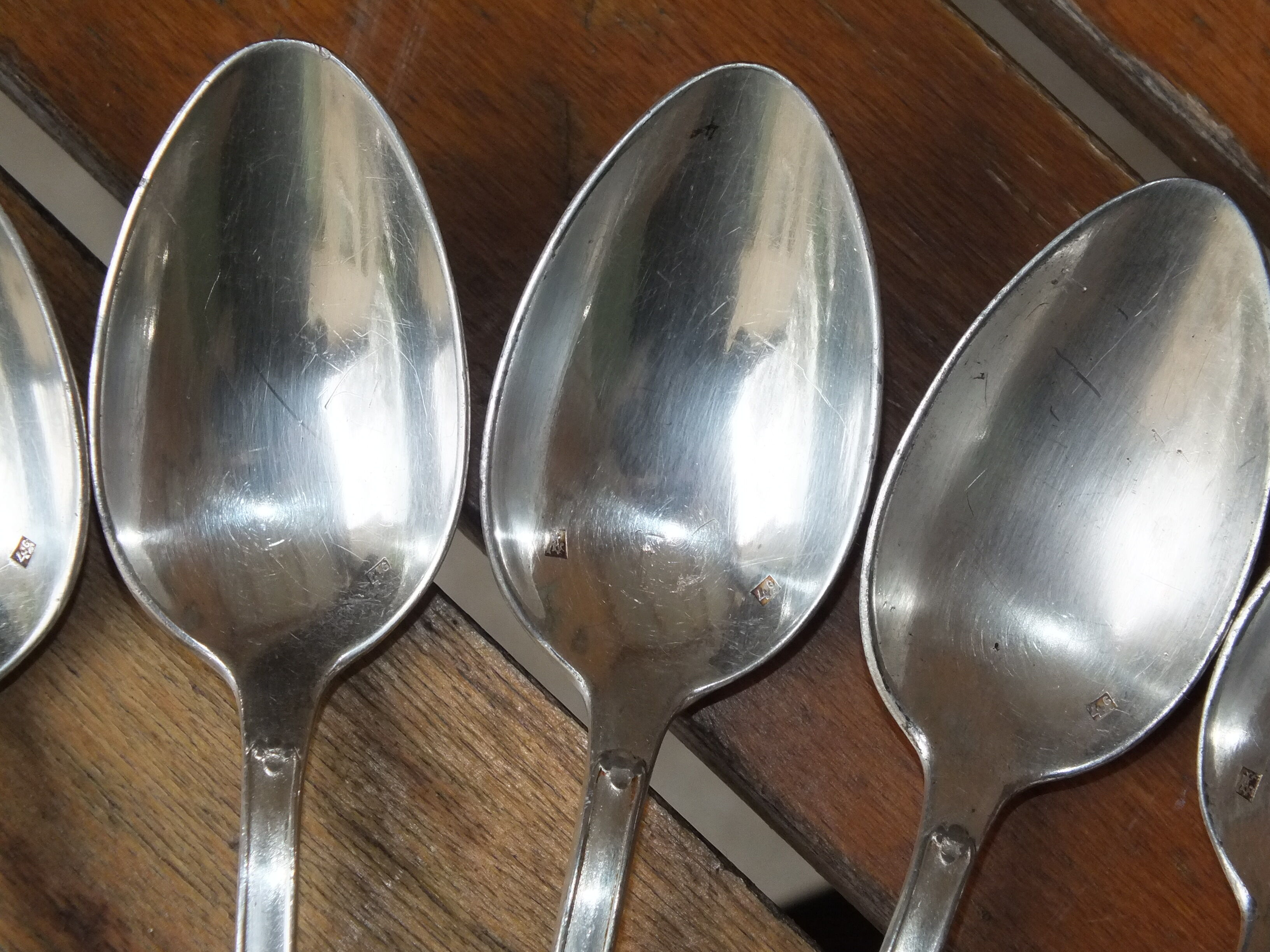 15 small silver metal spoons with rows of beads