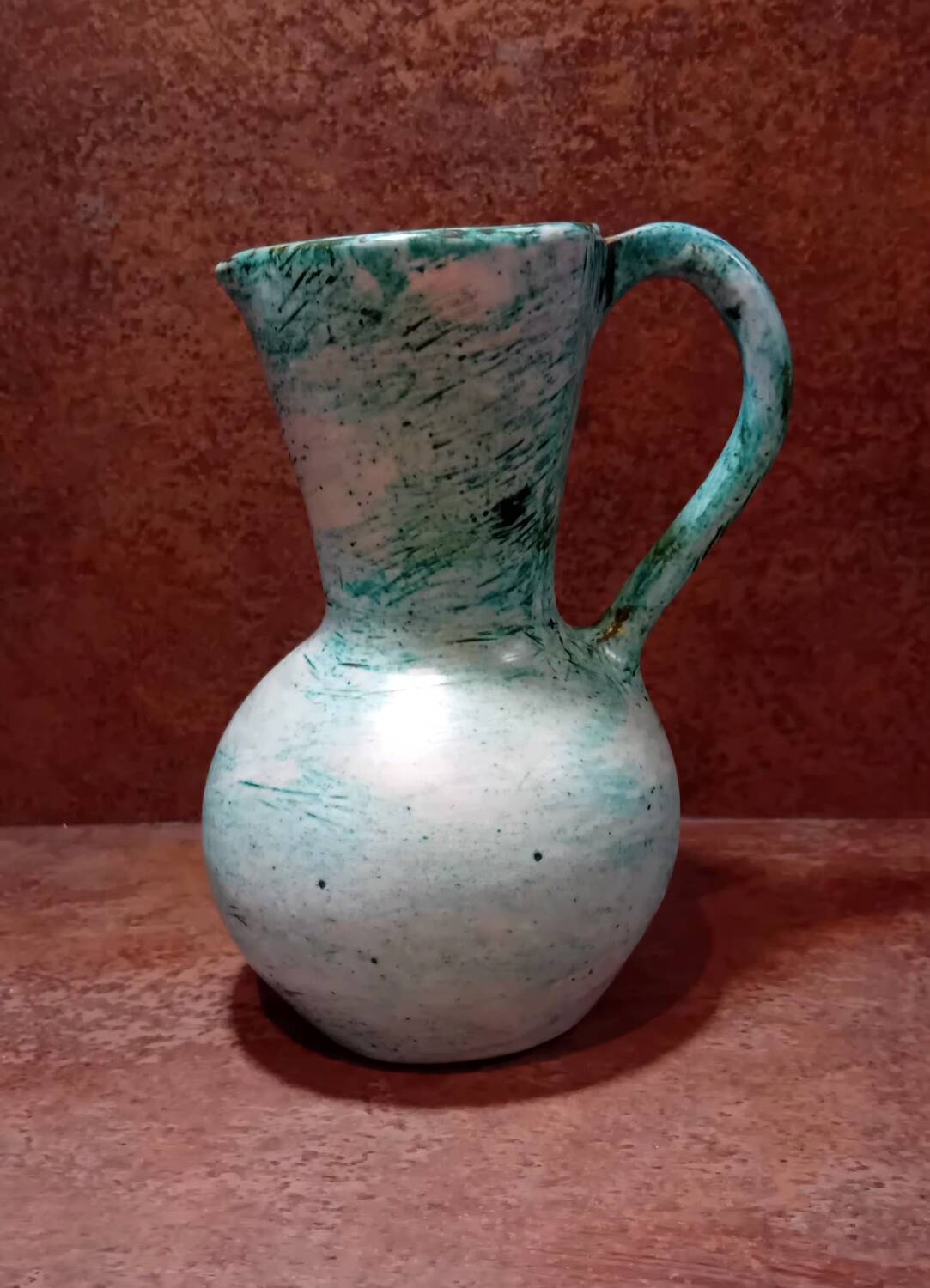 Turquoise ceramic pitcher vase