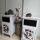 Two solid wood bedside tables with calfskin decoration.