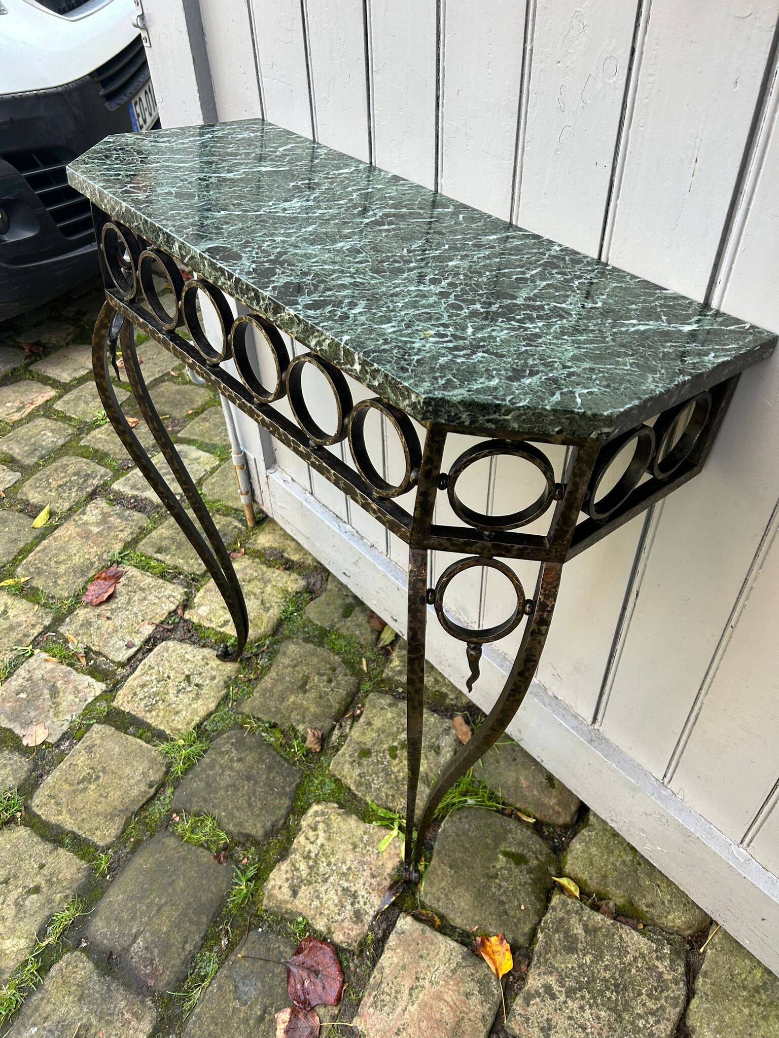 Console in wrought and hammered iron and green marble