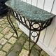 Console in wrought and hammered iron and green marble