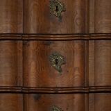 Antique baroque oak commode from the late 18th century with cabriole legs.