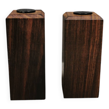A set of salt and pepper shakers in rosewood