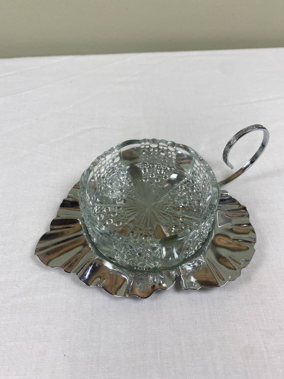 Metal and glass bowl