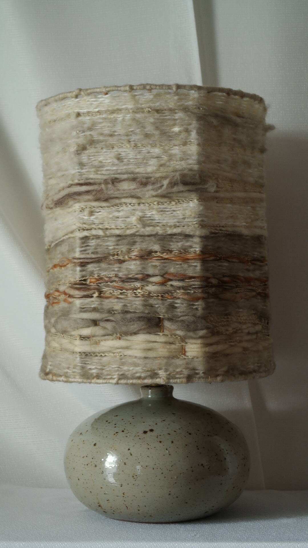 Vintage ceramic lamp with a wool shade.