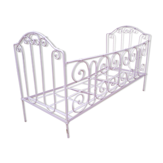 Old wrought iron metal bed bench