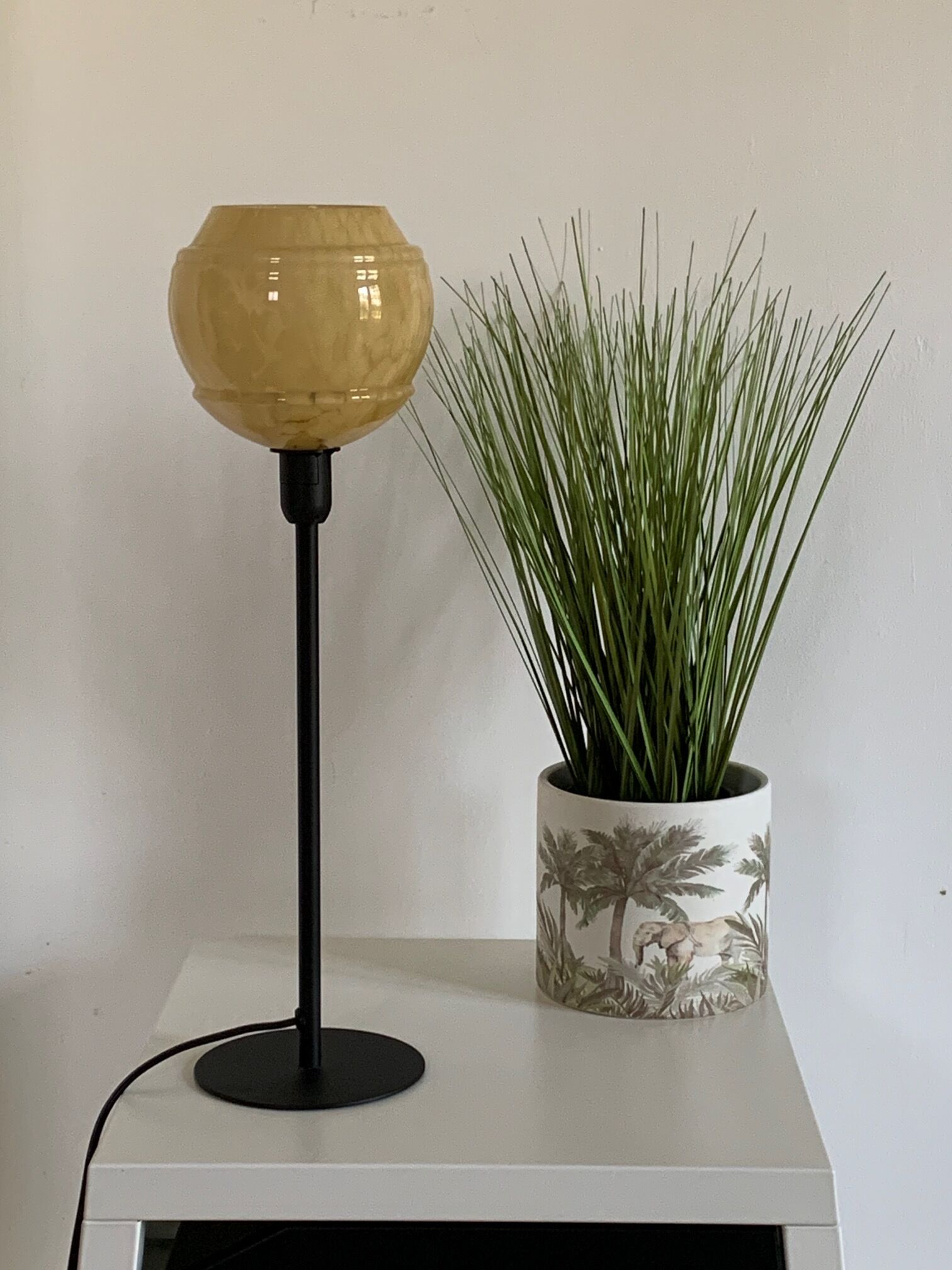 Table lamp with an antique vintage glass lampshade, between gold and camel, with a golden foot