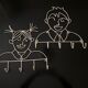 Pair of iron coat holders girl and boy