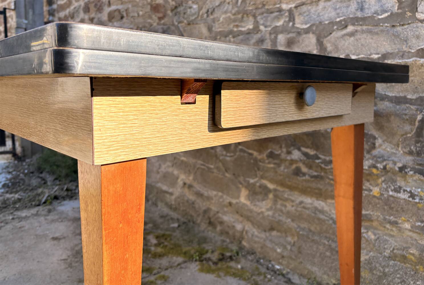 Beige French modernist extendable table, wooden legs, circa 1955.
