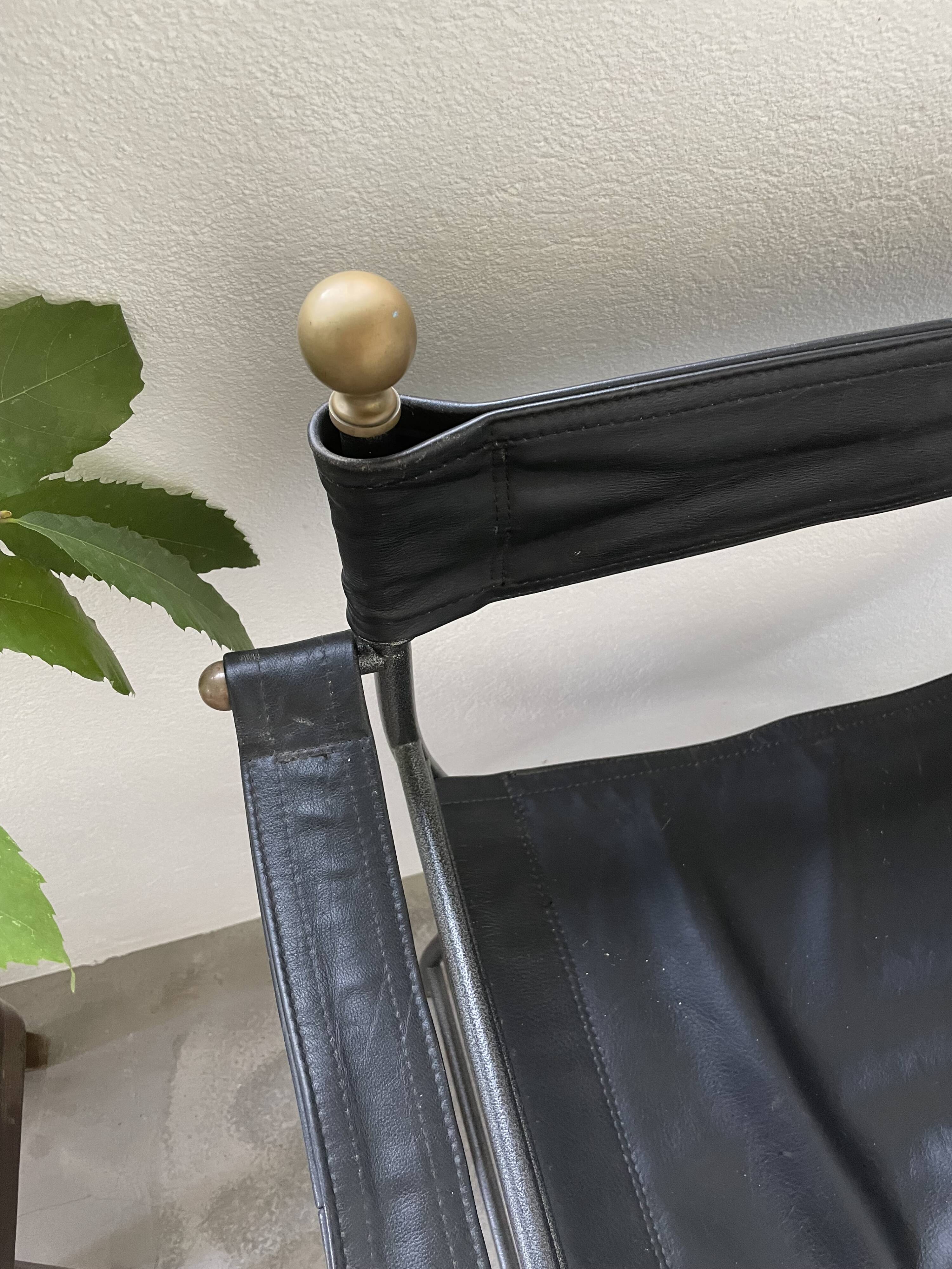 Pair of leather “curule” emperor armchairs