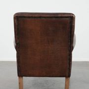 Characterful sheep leather armchair with a beautiful deep colour