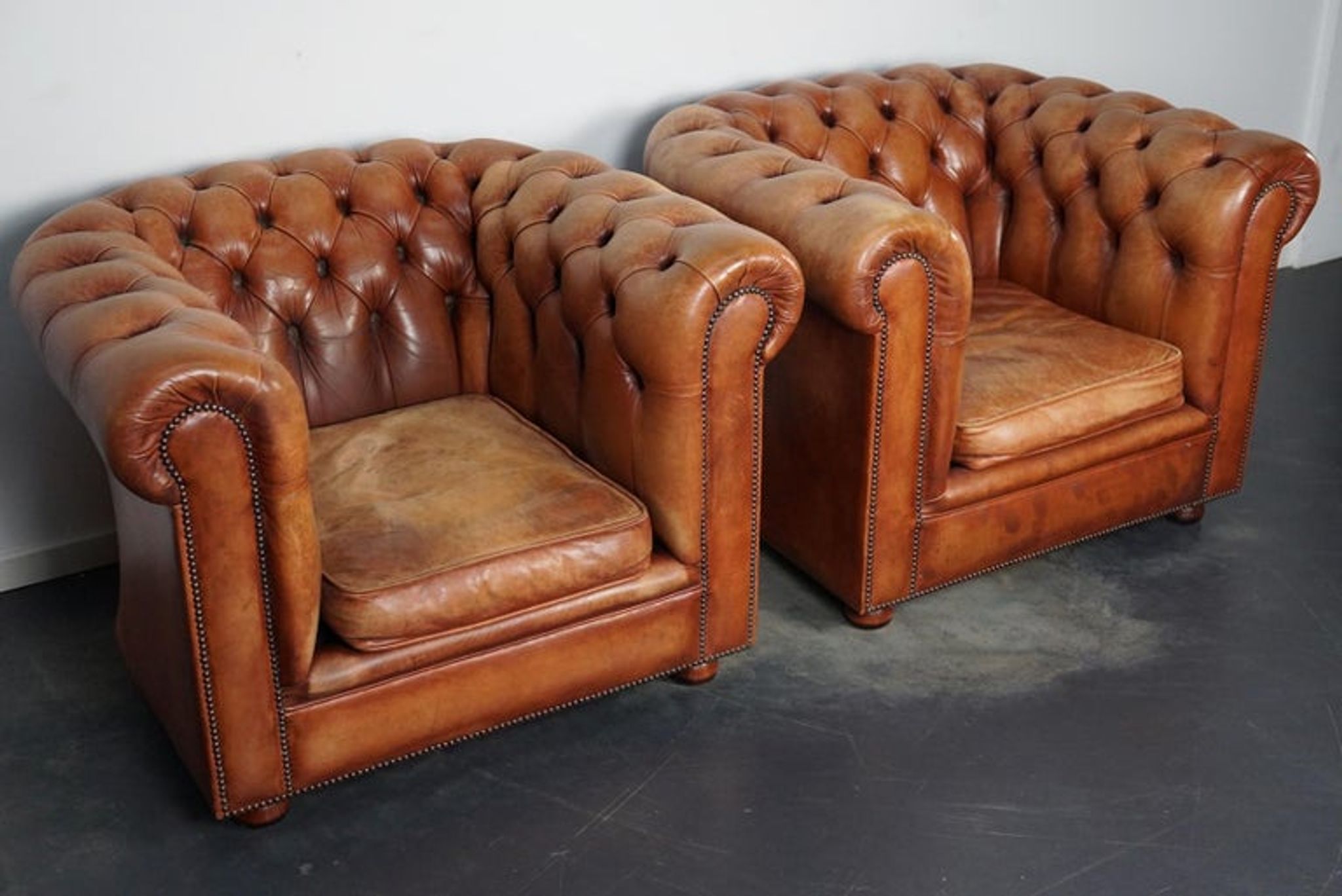 Set of 2 vintage chesterfield club armchairs in cognac leather, Netherlands,