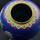 Chinese cloisonné vase decorated with peonies on a blue background, height 15 cm