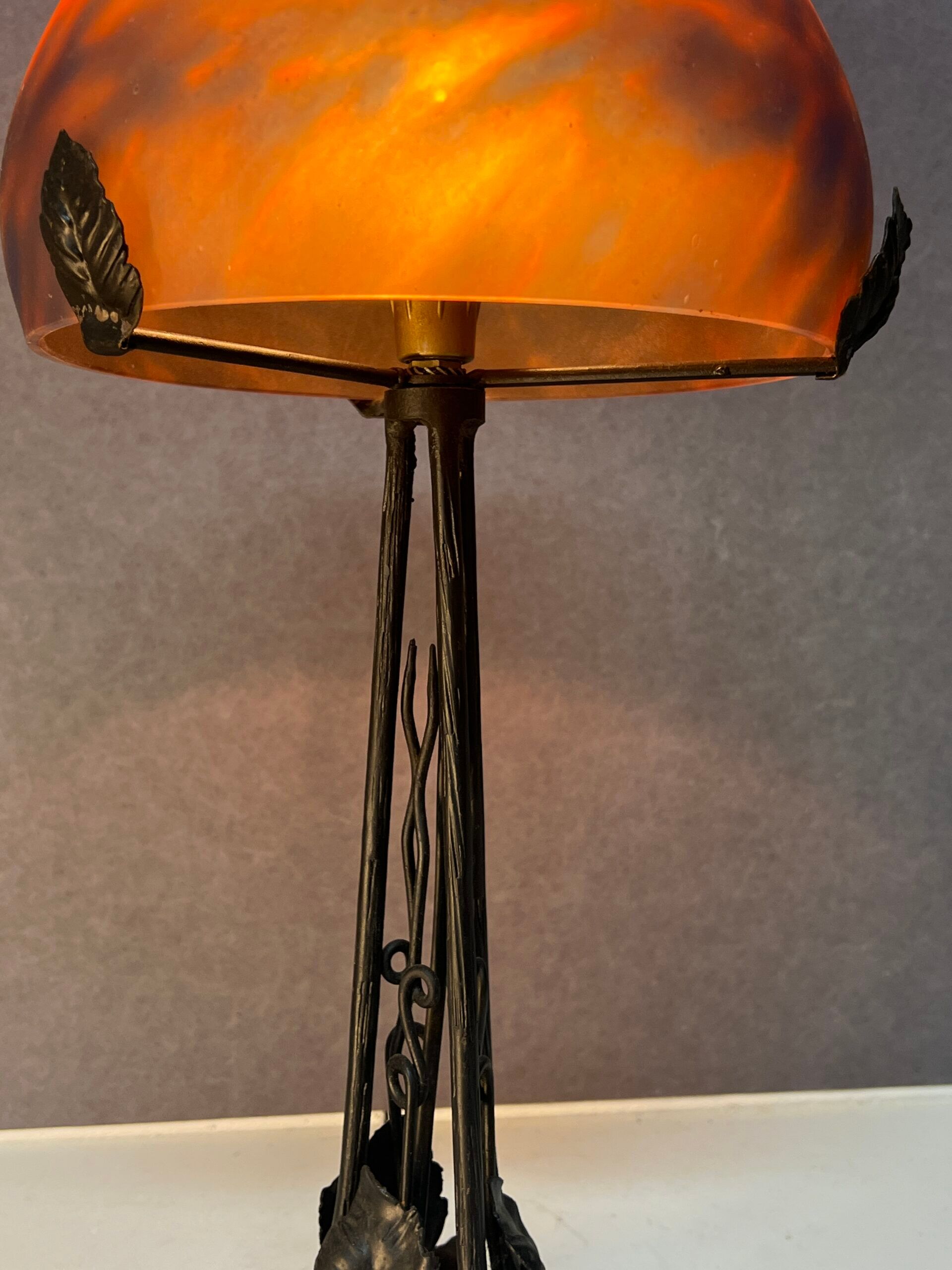 Contemporary mushroom lamp, wrought iron base and orange glass shell with blue hues in the art deco style