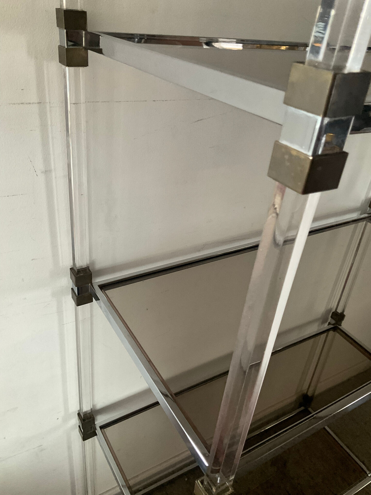 Vintage shelf in lucite, brass, and smoked glass from the 1970s.