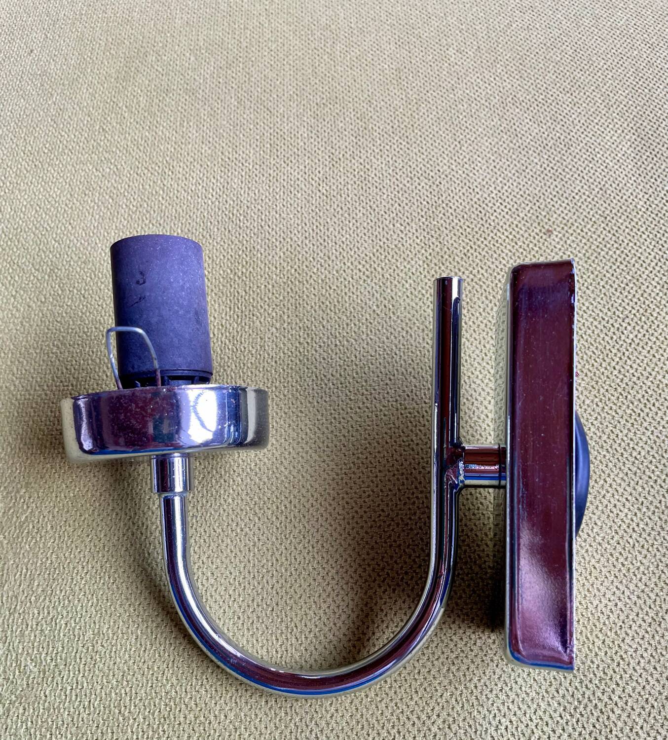 Pair of chrome metal wall lights with white glass globe.