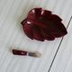 Red ceramic butter dish with knife