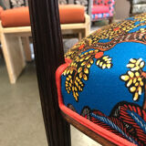 Art Nouveau armchair with a floral seat and backrest.