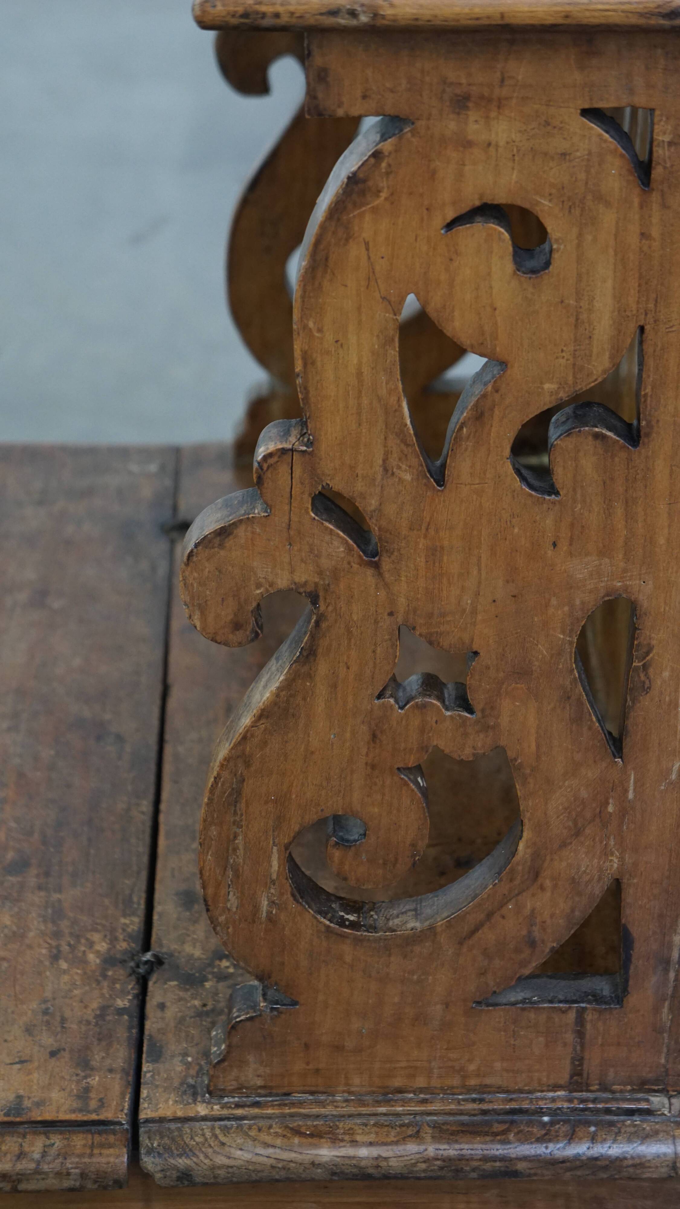 Antique pinewood church pew with storage compartments from the 18th century
