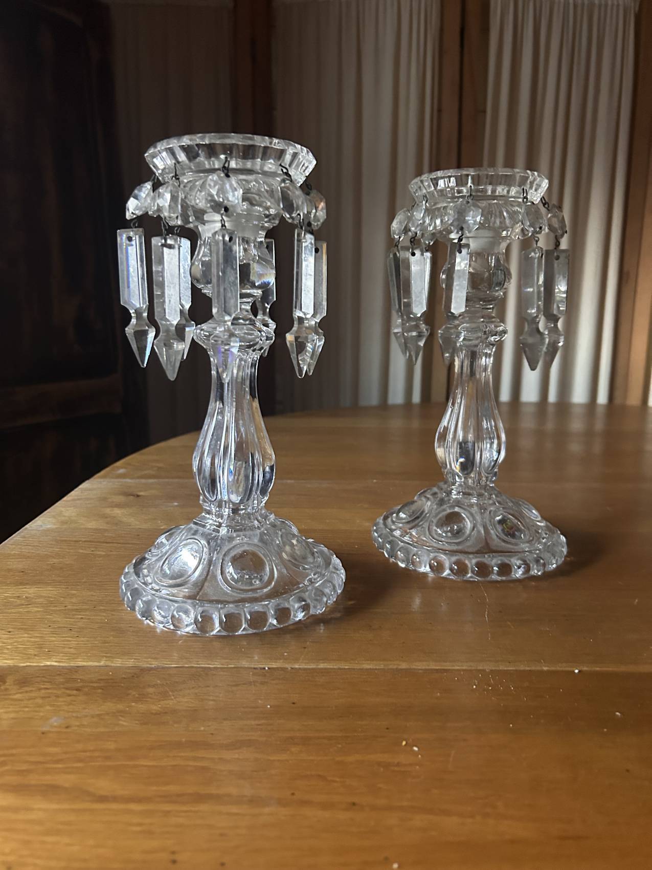 Pair of large Baccarat crystal candlesticks with pendants, a rare choice.