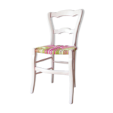 Chair mulched in strands of fabric