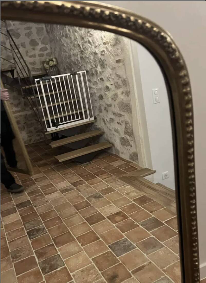 Large gilded mirror with pediment