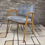 Vintage armchair from the 60s/70s in wood and grey fabric – with armrests.