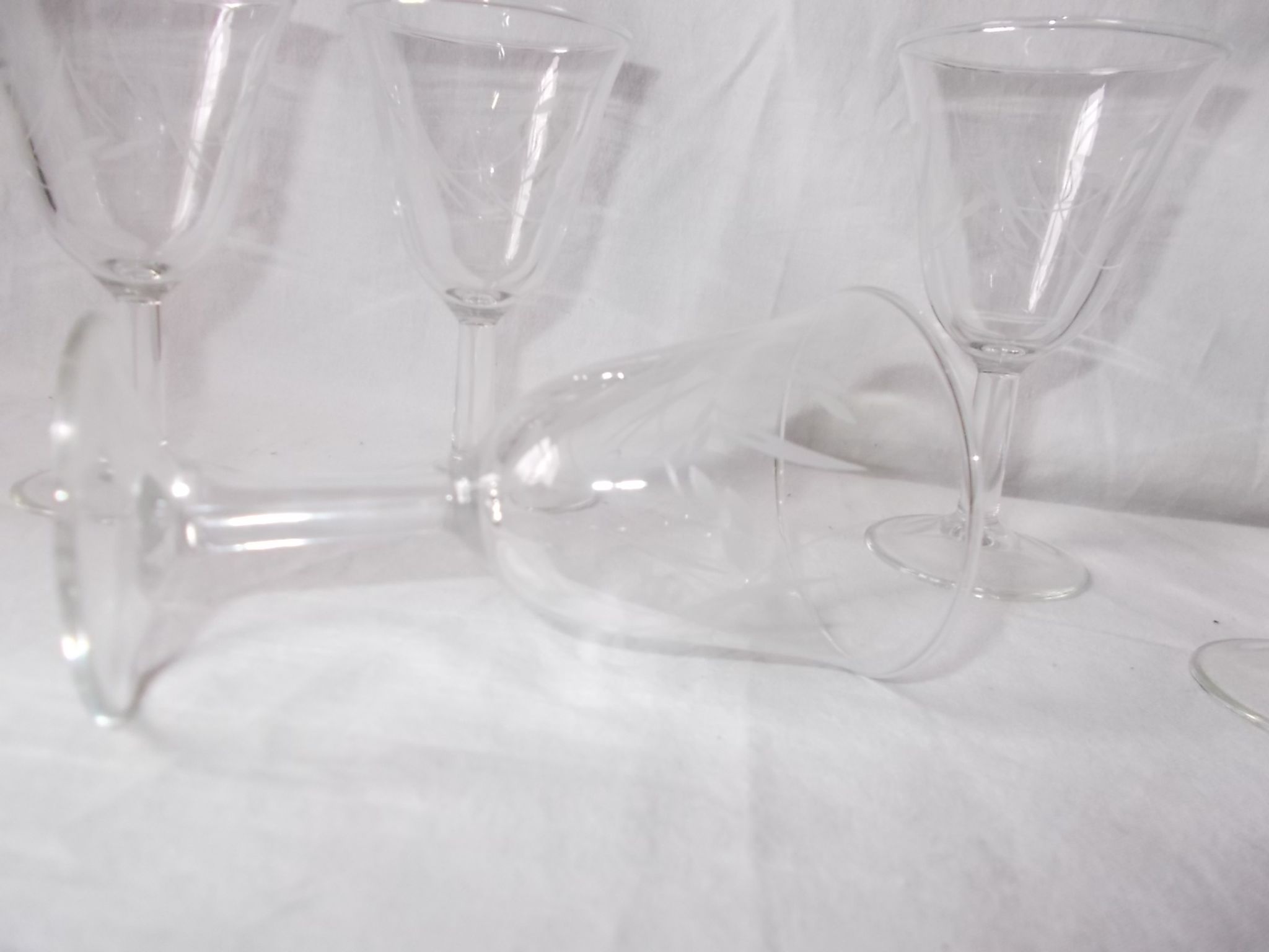 Set of 6 antique decorated wine glasses.