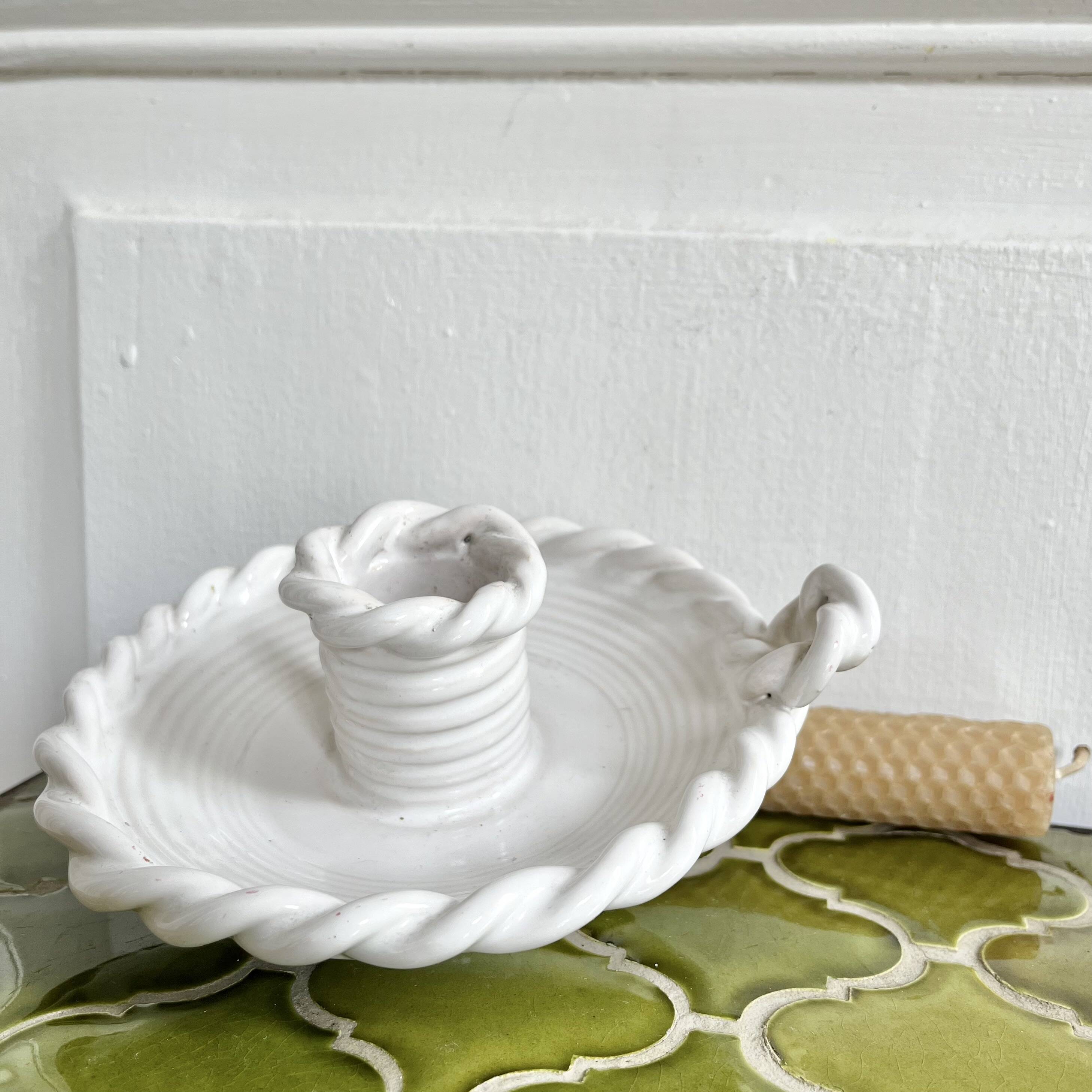 Hand-held candle holder with braided ceramic bowl