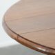Antique English drop-leaf dining table made of walnut with elegant legs