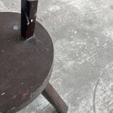 Black solid wood vintage tripod stool with angled back peg — France, 1960s