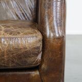 Grained cowhide armchair with a timeless design
