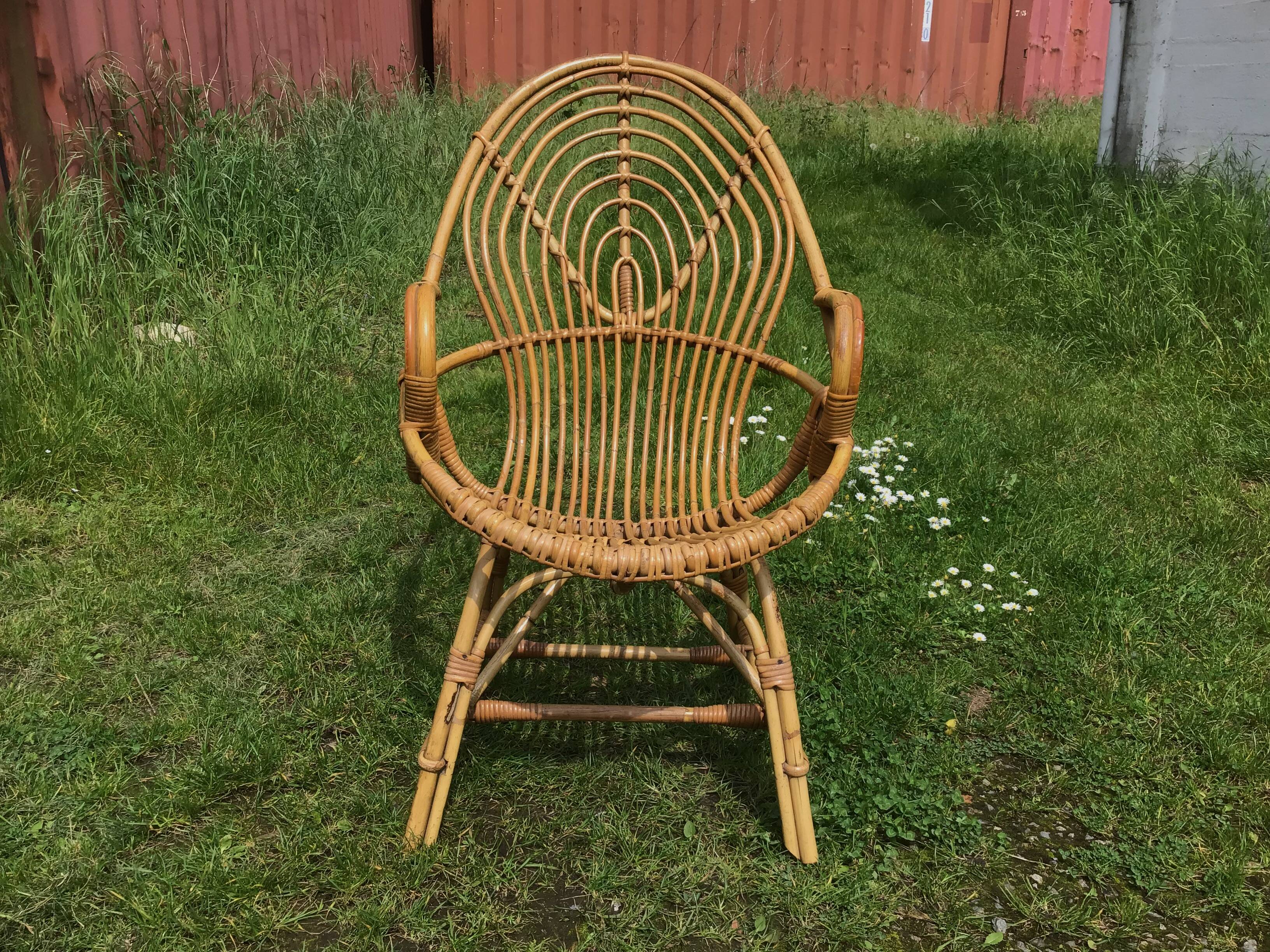 Vintage ovoid-shaped rattan armchair.