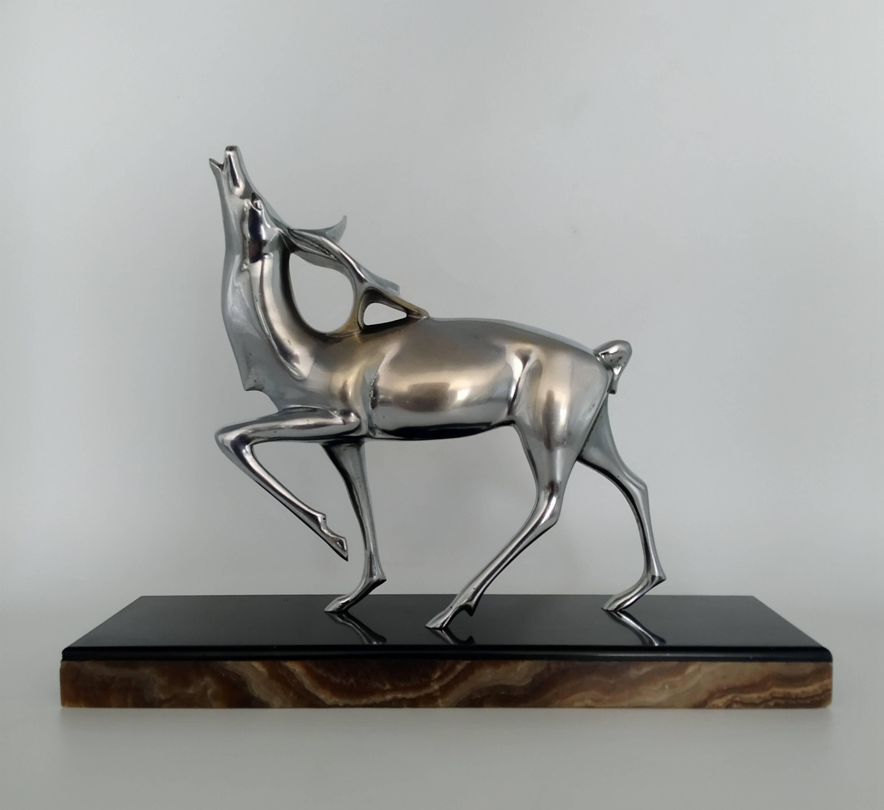 Silvered bronze sculpture signed by Michel Decoux.