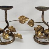 Pair of brass candle holders decorated with patinated metal flowers